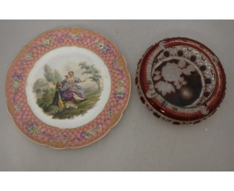 A 19th Century Sèvres hand-painted cabinet plate, the centre field decorated with lovers in a landscape, within a pink ground