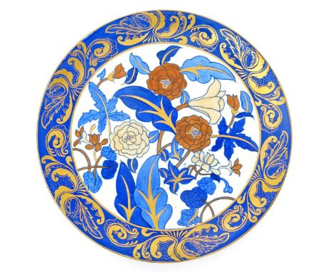 A Bursley Ware charger designed by Charlotte Rhead,  pattern no.1420, tubeline decorated with flowers and foliage in blue and