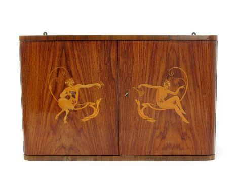 An Art Deco walnut wall cabinet probably by Laszlo Hoenig,  the twin-hinged doors each decorated with a marquetry panel of a 