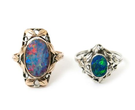 A silver and opal ring the design attributed to Rhoda Wager, simple foliate frame with central opal stone, and another smalle