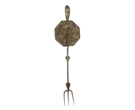 A polished steel toasting fork designed by Ernest Gimson, made by Alfred Bucknell, with articulated fire guard, the stem with