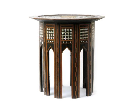 An Anglo-Persian occasional table probably retailed by Liberty & Co, decagonal section on ten arched legs, set with marquetry