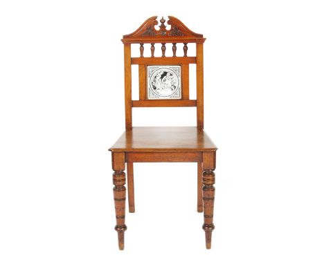 A mahogany hall chair, on turned legs, the back inset with Minton Shakespeare Series tile by John Moyr Smith, 91cm. high