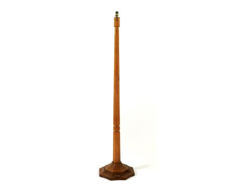 A Robert Mouseman Thompson oak floor lamp, on octagonal stepped base with carved mouse signature, 143cm. high Provenance Purc