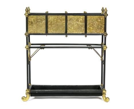 An Aesthetic Movement brass and patinated metal plant stand,  the rectangular trough set with ten brass panels stamped in low