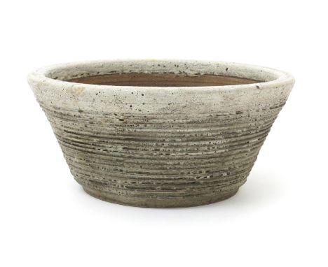 ‡  Dame Lucie Rie DBE (1902-1995) a stoneware planter or Bonsai jardiniere, flaring cylindrical form with incised bands, glaz