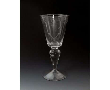 ‡ Sir Laurence Whistler  (1912-2000) a diamond point engraved glass Chi Rho goblet, decorated with a band of vine leaves abov