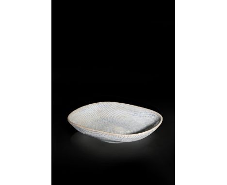 ‡  Dame Lucie Rie DBE (1902-1995) a stoneware shallow bowl, rounded rectangular section, glazed white with inlaid blue veins,