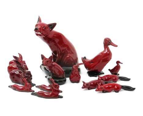 Seated Fox HN.130 a large Royal Doulton Flambe animal,  covered in a flambe red glaze, another smaller, a flambe duck and ele