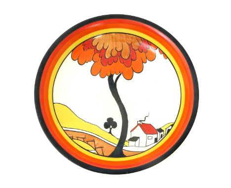 'House and Bridge' a rare Clarice Cliff Fantasque Bizarre wall charger, painted in colours inside yellow, orange, red and bla
