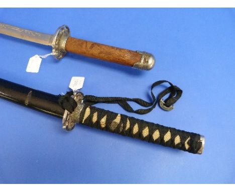 A 20th century Japanese Samurai Kutana Sword, with 27in (68.5cm) blade and black lacquered scabbard, together with a Japanese