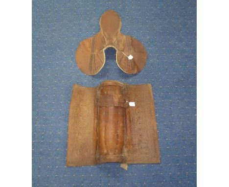 A Vintage South American Gaucho leather Horse Saddle, together with girth strap, blinkers, stirrup pad, gaucho belt and a rac