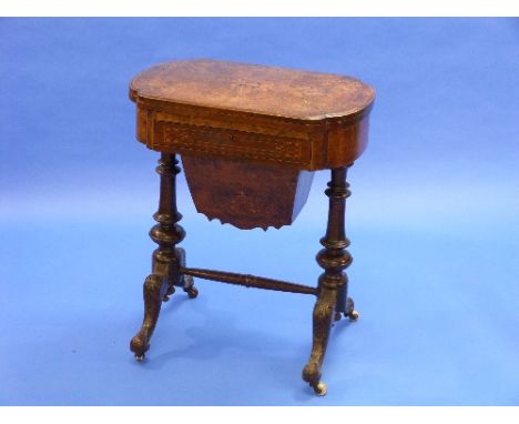 A Victorian walnut and boxwood marquetry Games Table / Work Table, the rounded rectangular hinged swivel top enclosing chess 