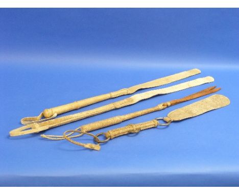 A Vintage rawhide Riding/Horse Quirt, together with three leather camel whips (4)