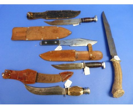 A large vintage Bowie knife, with 13½in (34.25cm) blade, brass cross guard and antler handle, together with a another Bowie k