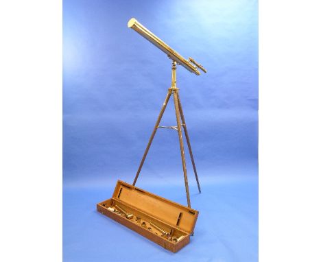 A vintage brass Telescope, with 40in (101.5cm) barrel, various lenses and tripod, in fitted wood box.