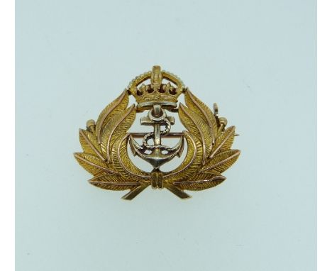 A 9ct yellow gold and red enamel Royal Navy Brooch, inscribed on the back 'from Jack Dec 1941', 1in (1.2cm) wide.