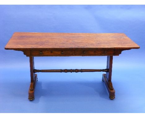 A Regency rosewood Library Table, the rectangular top with rounded corners above two frieze drawers and opposing dummy drawer