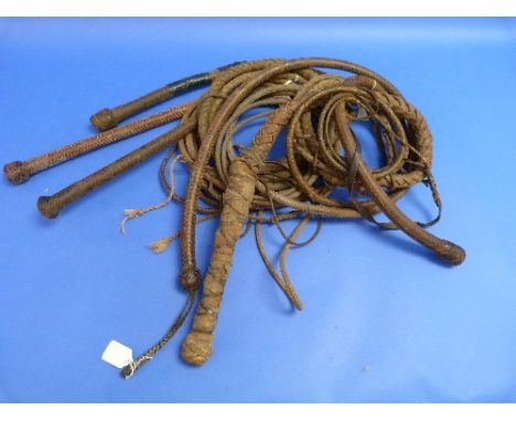 A Vintage leather Snake Whip, with weighted braided butt knot, together with five other snake whips (6)