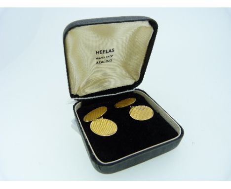 A pair of 9ct gold Cuff-Links, of oval form with engine-turned decoration, approximate total weight 8g (2)