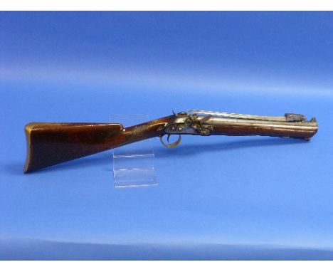 An early-19th century Flintlock Blunderbuss, signed Egg, with 14½in (37cm) steel barrel inscribed "London", spring bayonet, s