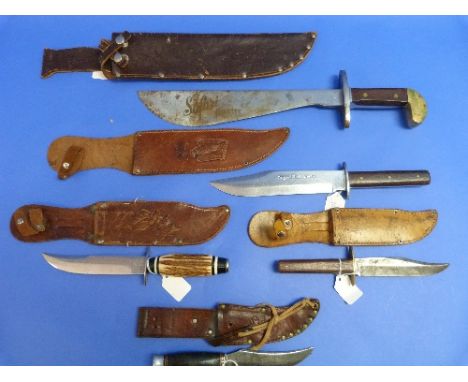 A large vintage Safari Hunter knife, by Carl Schlieper, Solingen, with 13¼in (33.5cm) blade, brass mounted wood handle and le
