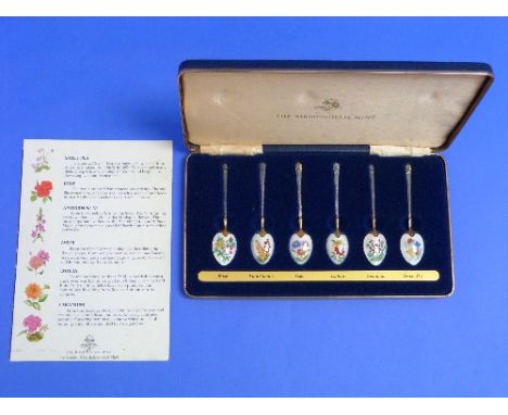 A cased set of six silver gilt and enamel Teaspoons, by the Birmingham Mint, hallmarked Birmingham 1978, the reverse of each 