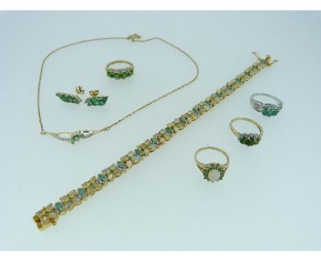 A small collection of modern Jewellery, including three green stone set rings, mounted in 9ct yellow gold, a necklet set gree