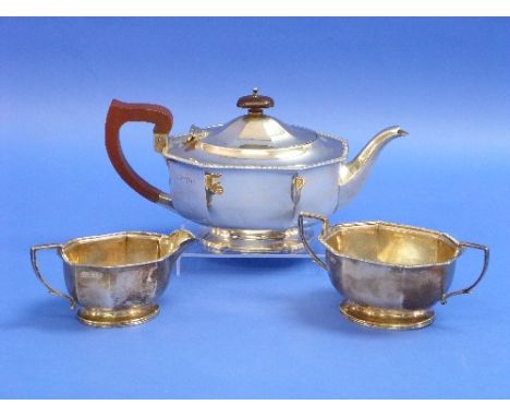 A George VI silver three piece Tea Set, by Adie Brothers Ltd., hallmarked Chester 1938, of octagonal form with gadrooned edge