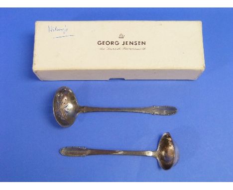 Georg Jensen; A beaded pattern Sifter Spoon, London import marks for 1925, 5½in (14cm) long, together with a small beaded pat