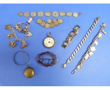 A quantity of Silver Items, including a shaped oval silver buckle, the front with purple guilloche enamel, two silver charm b