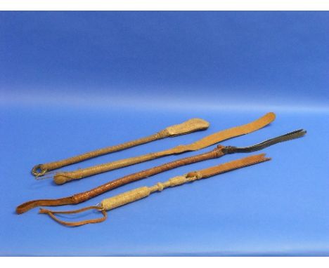 A Vintage rawhide Riding/Horse Quirt, with lead weighted braided handle, together with another quirt and two camel whips (3)