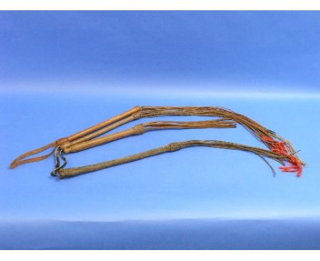 A Vintage Swaine Adeney leather Breaking Whip/Flay, with plaited leather handle over a steel centre and plaited butt knot ter