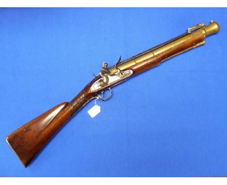 A late-18th century Flintlock Blunderbuss, signed Spencer, with 16in (40.5cm) belled brass barrel, spring bayonet, walnut sto