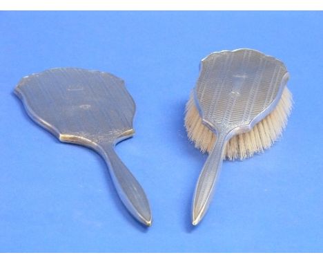 A cased set of George VI silver mounted Hairbrushes with Comb, by W I Broadway & Co., hallmarked Birmingham, 1949, the brushe