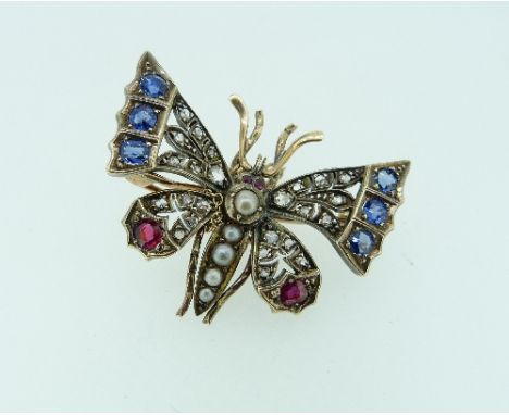 An attractive late Victorian gem set Butterfly Brooch, each wing set with rose cut diamonds, sapphires and a ruby, with one r