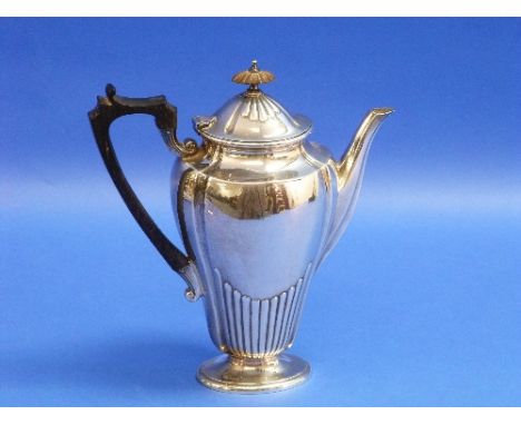 A Victorian silver Teapot, by Elkington & Co. Ltd., hallmarked Birmingham, 1891, of tapering ovoid form with demi-fluted deco
