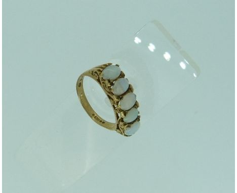 A five stone oval opal Ring, set in a carved gallery in 9ct yellow gold, Size M.