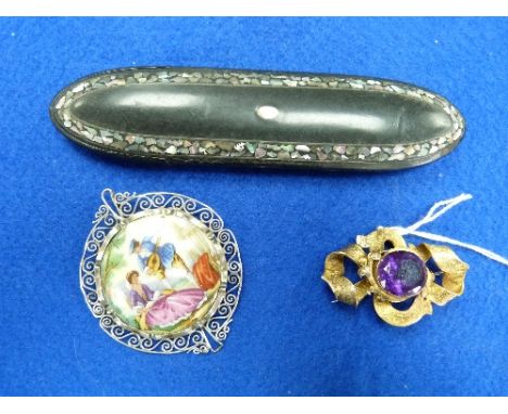 A Victorian pinchbeck Brooch, of knot design, the centre with facetted purple stone, together with a Victorian papier mache l