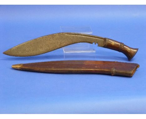 A W.W.1 period military issue Kukri (Kukuri) Knife, marked "17" for 1917, with leather scabbard.