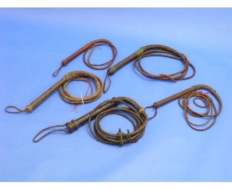 A Vintage American leather Cow Whip, with leather handle, and woven keeper, together with four other American cow whips (5)