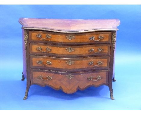 A 19th century French kingwood and gilt-metal mounted marquetry Commode, of serpentine form, the moulded top above three long