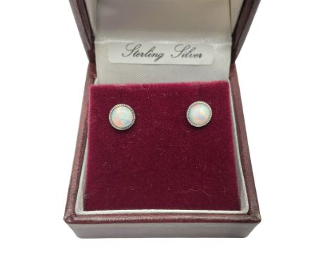 Pair of silver opal stud earrings, stamped 925, boxed Condition Report:Diameter = 6mm