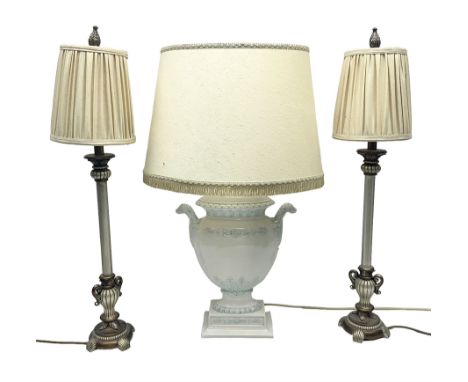 Ceramic table lamp of urn form with bird mask handles, upon a stepped rectangular base, together with two other, including sh