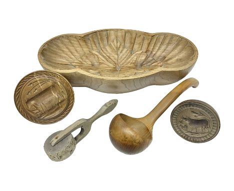 Carved wooden mould, together with two carved wooden butter/pastry presses, pastry wheel and a turned wooden ladle