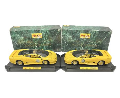 Two Maisto 1:12 scale Jaguar XJ220 ‘Racing’ cars in yellow, both on plinths in original boxes 