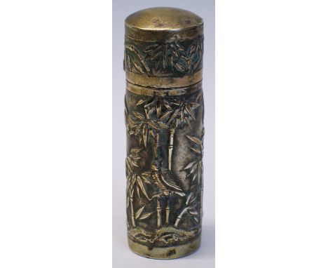 A Chinese perfume bottle, of cylindrical form cast with a continuous panel of birds amongst bamboo, the slightly domed hinged