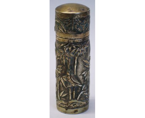 A Chinese perfume bottle, of cylindrical form cast with a continuous panel of birds amongst bamboo, the slightly domed hinged