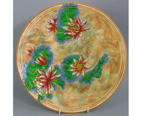 A Royal Doulton wall plaque, of circular form painted with flowers and leaves on a mottled buff ground, 34.5cm diameter