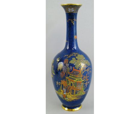 A Wiltshaw & Robinson Carlton Ware vase, of bottle shaped form gilded and enamelled in the "Mikado" pattern on a powdered blu